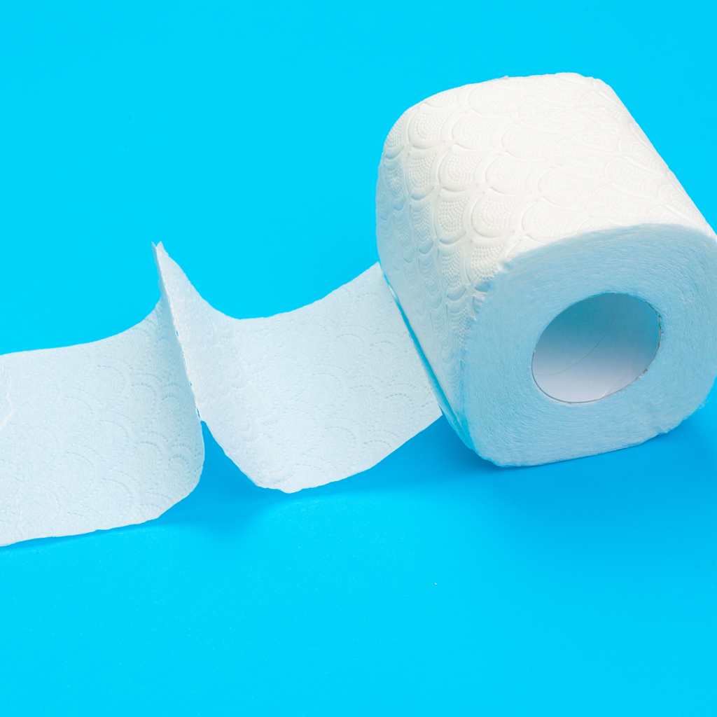 A roll of white toilet paper partially unrolled on a blue background.
